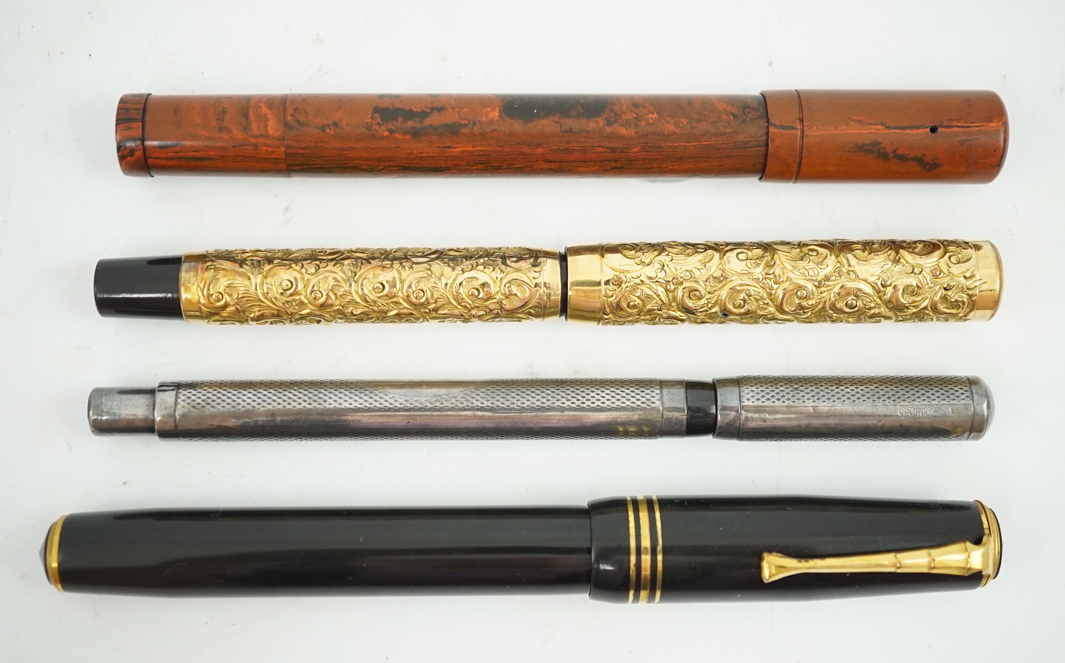 Four sundry fountain pens to include a silver hallmarked Eyedropper